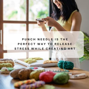 May include: A woman is working on a punch needle project. She is surrounded by colorful yarn and has a finished piece on a hoop. The text "PUNCH NEEDLE IS THE PERFECT WAY TO RELEASE STRESS WHILE CREATING ART" is displayed on the image.