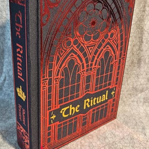The Ritual by Shantel Tessier: Hardcover Special Edition romance book rebinding with sprayed edges, satin bookmark, and charm.