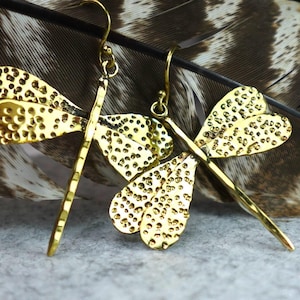 Textured Brass Dragonfly Earrings - Nature-inspired dangle earrings with hammered dragonfly motifs in antique brass.