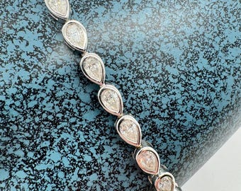 Pear Cut Moissanite Tennis Bracelet: Sterling Silver Bezel Set