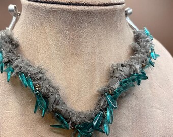 Textile Art Necklace, wrapped in gray trim and blue dagger beads