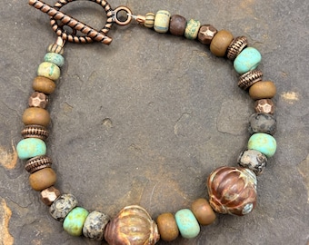 Beaded Bracelet made with Czech glass beads and copper beads.