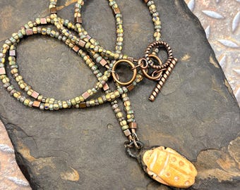 Scarab Pendant, on beaded necklace made of Czech beads with a matt finish