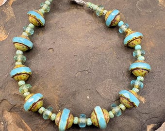 Beaded Bracelet Blue Saturn beads with faceted blue spacers