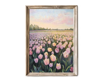 Puede incluir: Una pintura de un campo de tulipanes rosas y blancos con un cielo suave y pastel en el fondo. La pintura está enmarcada en un marco de madera claro.