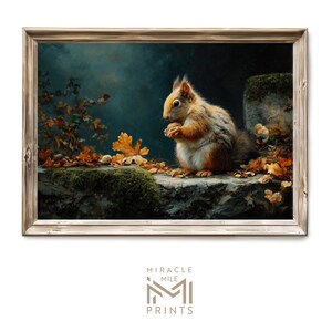 May include: A framed print featuring a detailed illustration of a squirrel in an autumn setting. The squirrel, with brown and orange fur, sits on a mossy stone ledge surrounded by fallen leaves. The artwork has a vintage aesthetic with a dark, moody background.