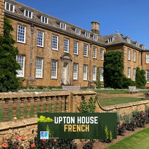 May include: Exterior view of a large, multi-story building with numerous windows and a stone facade. The building is set against a clear blue sky, with a well-maintained lawn and garden in the foreground. A sign reads "UPTON HOUSE FRENCH".