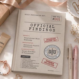 May include: A beige hardcover notebook titled Delulu Investigation Dept. Official Findings. The cover features a case file layout with text including Subject: Suspicious Bias Activity, Investigator: Emotional Support Specialist, and a DIU stamp.