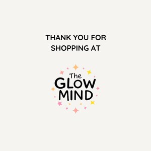 May include: Cream-colored background with the text "THANK YOU FOR SHOPPING AT" in black. Below, a logo with the words "The GLOW MIND" in black, surrounded by a circle of pink, yellow, and orange stars.