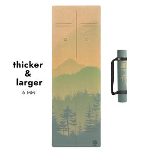 May include: A yoga mat with a landscape design featuring mountains and trees in shades of green, brown, and blue. The mat is 6 mm thick and is shown with a matching carrying case.