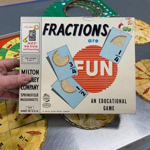 Vintage “Fractions are Fun” Educational Board game. Uses slices of pies to illustrate fractions as a fun, interactive way to teach math.