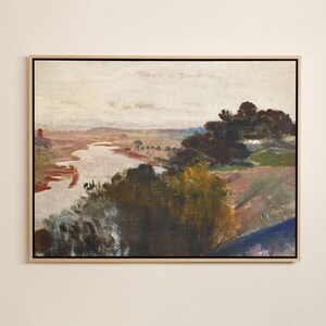May include: An oil painting depicting a landscape with a river. The artwork uses a muted colour palette with shades of brown, green, and blue. The painting is framed in a light-coloured wooden frame.