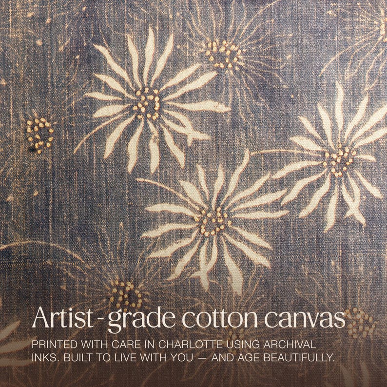 May include: Artist-grade cotton canvas with a repeating floral pattern in cream and tan on a dark blue background. The text reads: "PRINTED WITH CARE IN CHARLOTTE USING ARCHIVAL INKS. BUILT TO LIVE WITH YOU - AND AGE BEAUTIFULLY."