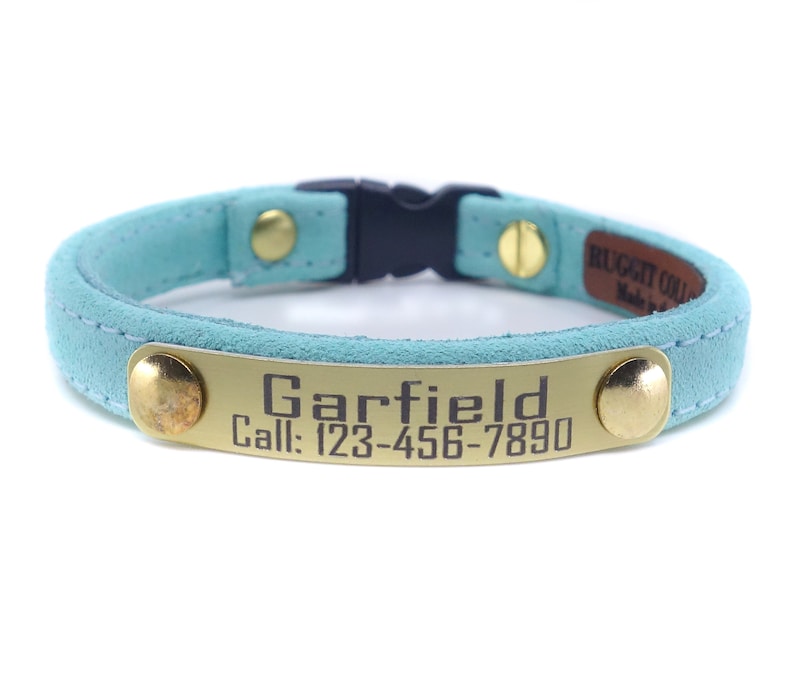 This is a personalized all suede and lined in suede cat collar. Custom made for cats as well as kittens. Non adjustable so follow measuring advise. Engraved lightweght aluminum plate displays your info in crisp easy to read, for a safe return.