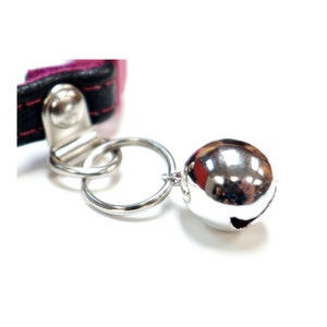 Cat collar bells. Silver or gold. Nice jingle to know where your is at all times.