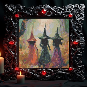 May include: A square cross-stitch pattern featuring three figures in pointed hats standing in a forest, framed in an ornate black border with embedded red circular gems. The figures are rendered in pixelated shades of orange, green, and purple.