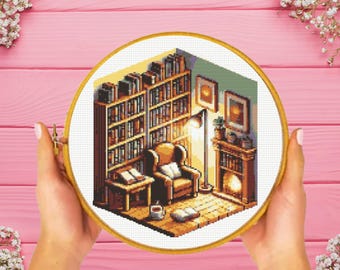 May include: A cross-stitch pattern of a cozy reading nook with a bookshelf filled with books, a comfortable armchair, a lamp, and a fireplace. The scene is rendered in a pixelated style, giving it a retro video game aesthetic.