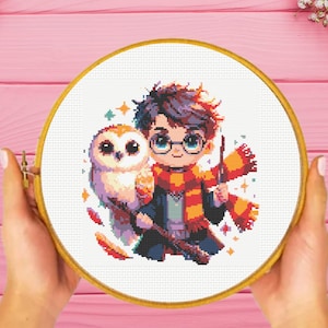 May include: A cross-stitch pattern featuring a cartoon illustration of Harry Potter with his owl, Hedwig. Harry is wearing his signature glasses, scarf, and robe. The background is filled with stars and feathers.