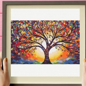 Puede incluir: Una pintura colorida de un árbol con una puesta de sol naranja, amarilla y roja brillante en el fondo.