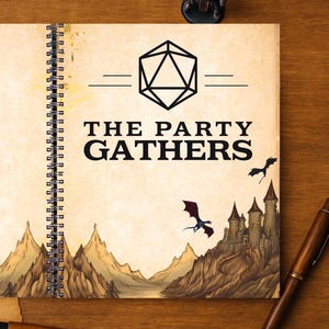 May include: Spiral-bound notebook with the text "THE PARTY GATHERS" and a geometric design. The cover features a fantasy landscape with mountains, a castle, and dragons. A miniature figurine and a pen are on the wooden surface.
