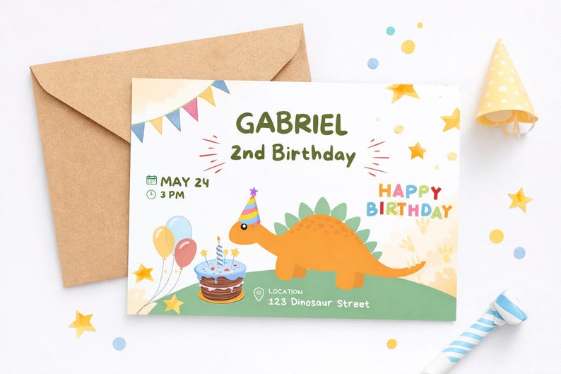 May include: A birthday invitation featuring a cartoon orange dinosaur wearing a party hat. The invitation reads "Gabriel 2nd Birthday" with the date, time, and location. Includes a brown envelope, party hat, and confetti.