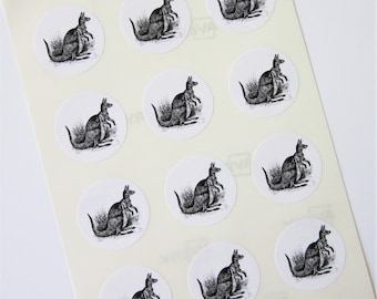May include: Sheet of 12 round white stickers with black and white illustrations of kangaroos. Each sticker features a kangaroo with a joey in its pouch.