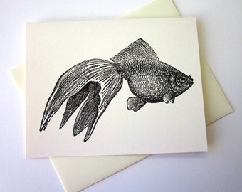 May include: Black and white line drawing of a goldfish with a long, flowing tail fin. The fish is swimming to the right.