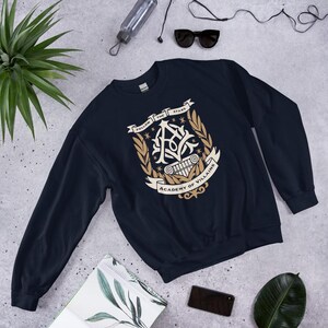 Academy of Villains Crest Unisex Sweatshirt | Officially Licensed Book Merch