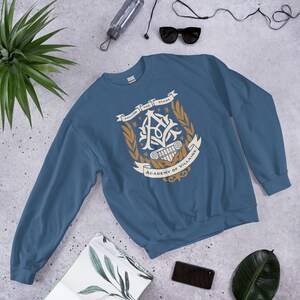Academy of Villains Crest Unisex Sweatshirt | Officially Licensed Book Merch