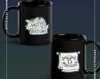 Of Moths and Stone Brand's Towel Black Glossy Mug | Officially Licensed K.R.Fryatt Mug