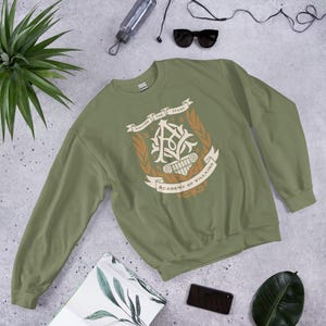 Academy of Villains Crest Unisex Sweatshirt | Officially Licensed Book Merch