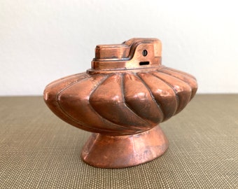 Ronson Regal tabletop lighter in gleaming copper with luxe swirled design, vintage 1950s smoking accessory