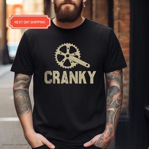 a man with a beard wearing a cranky t - shirt