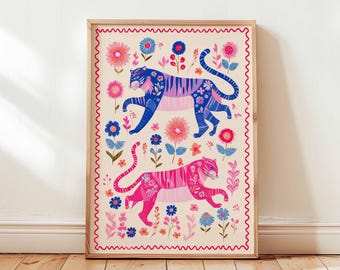 May include: A framed art print featuring two stylized tigers in blue and pink, adorned with floral patterns. The artwork is set against a cream background with a red wavy border, and surrounded by colorful flowers. The print is displayed on a wooden floor.
