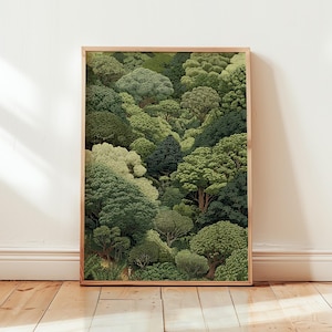 May include: A framed art print depicting a lush forest. The image is filled with various shades of green trees, creating a layered effect. The print is set within a light brown wooden frame. The artwork evokes a sense of nature and the outdoors. The overall theme is landscape.