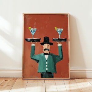 Puede incluir: Una impresión artística enmarcada representa a un camarero con chaqueta verde y sombrero negro, sosteniendo dos bandejas con cócteles. El fondo es de color marrón rojizo. Los cócteles tienen un líquido azul y una guarnición de limón.