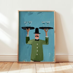 Puede incluir: Una impresión artística enmarcada representa a un camarero con abrigo verde y sombrero negro, sosteniendo dos bandejas con copas de martini. El fondo es de color turquesa. La obra de arte tiene un estilo ilustrativo caprichoso, con pinceladas visibles.