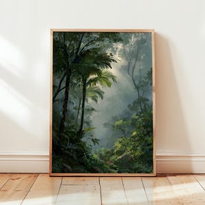 May include: A framed art print showing a tropical rainforest scene. The artwork features tall palm trees, dense green foliage, and sunlight filtering through the canopy, creating a serene and vibrant landscape.