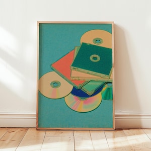 May include: A framed print featuring a collection of CDs and jewel cases in a retro style. The CDs are in shades of yellow, blue, and rainbow colors, while the cases are green and orange. The background is a teal color.