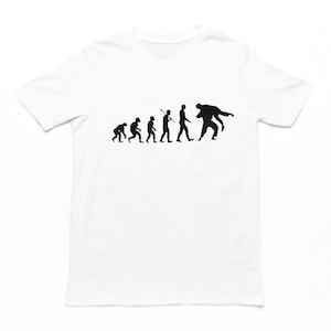 May include: White t-shirt featuring a black silhouette of the evolution of man, culminating in a man in a wrestling hold.