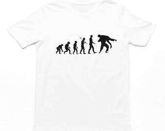 May include: White t-shirt with a black silhouette of the evolution of man, ending with a man in a wrestling hold.