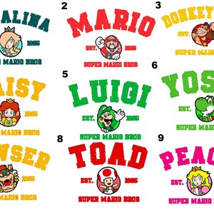 May include: Nine Super Mario Bros. character designs on a white background. Each design features a character's name in a bold, distressed font, the text "EST. 1985", and the words "SUPER MARIO BROS". Characters include Rosalina, Mario, Donkey Kong, Daisy, Luigi, Yoshi, Bowser, Toad, and Peach.