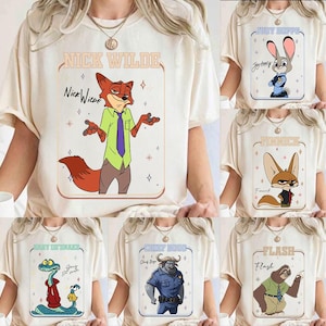 May include: Cream-colored t-shirts featuring characters from the animated film Zootopia. Each shirt displays a different character: Nick Wilde, Judy Hopps, Finnick, Jerry Jumbeaux Jr., Chief Bogo, and Flash. The character names are printed above or below the character illustrations.