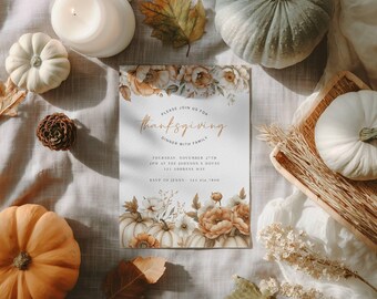 May include: Thanksgiving invitation with floral and pumpkin accents. The invitation reads "Please join us for Thanksgiving Dinner with Family". The design includes pumpkins, leaves, and a candle, creating a fall theme.