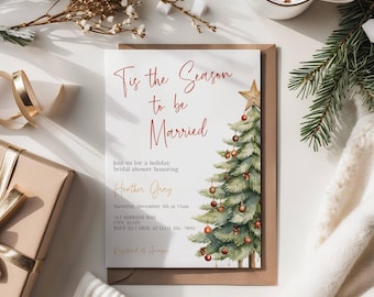 May include: A white rectangular bridal shower invitation card featuring a watercolor Christmas tree with red ornaments and a gold star. The text reads Tis the Season to be Married, join us for a holiday bridal shower honoring Heather Gray.