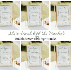May include: A set of six framed table signs with gold borders and light green and white patterned backgrounds. The signs are for a bridal shower and include text such as "Mimosa Bar", "Take a Favor", and "She's Fresh Off the Market Bridal Shower Table Sign Bundle."