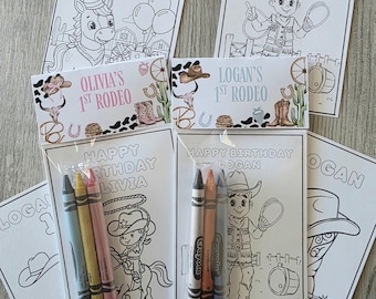 May include: Coloring book sets with crayons, featuring cowboy and cowgirl themes. Each set includes a coloring page with the text "Happy Birthday Logan" or "Happy Birthday Livia", and a small pack of crayons.