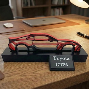 May include: A distressed wooden sign with the words "Welcome to our home" in white. The sign has a rustic finish, ideal for adding a welcoming touch to any home's entrance.