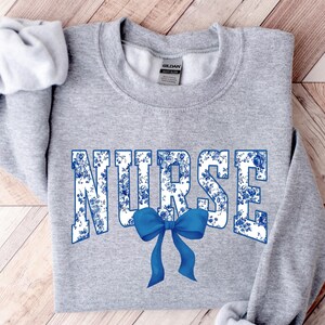 Toile De Jouy Nurse Bow Sweatshirt, Coquette Nurse Shirt, Gift For Nurse, Nurse Ribbon Hoodie, Registered Nurse Shirt, Floral Nurse Hoodie