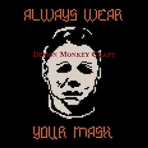 May include: A white pixelated image of Michael Myers from the Halloween franchise wearing his iconic mask. The text "ALWAYS WEAR YOUR MASK" is in orange above the image and "DEMON MONKEY CRAFT" is in red below the image.